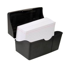 a black box with two dividers on it and a note pad in the bottom