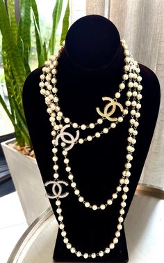 This 60” real pearl necklace can be wrapped up to 3 times , worn long or short ! It’s designer inspired with the vintage buttons from designer collection. It is also shown with a shorter 18” layered necklace this can be ordered in silver tone or gold . Chanel Pearl Necklace, Vintage Chanel Jewelry, Repurposed Necklace, Layered Pearl Necklace, Real Pearl Necklace, Pearl Vintage, Chanel Necklace, Chanel Pearls, Vintage Repurposed