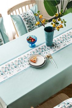 the table is set with blue and white cloths