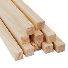 several pieces of wood stacked on top of each other in front of a white background