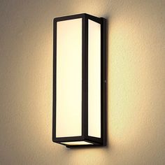 an outdoor light mounted on the side of a wall