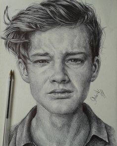 a pencil drawing of a young man's face