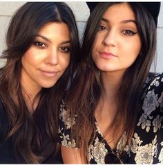 two beautiful young women sitting next to each other