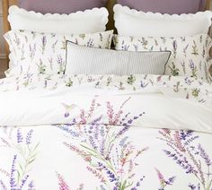 an image of a bed with lavender flowers on it