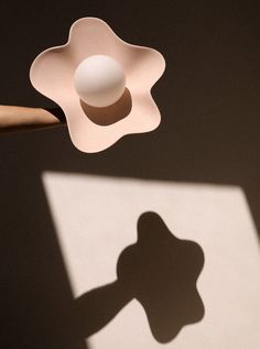 an object casting a shadow on the wall