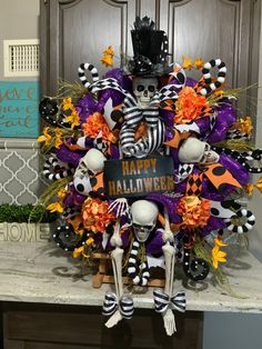 a halloween wreath with skeletons and pumpkins