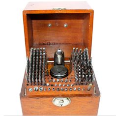 an old wooden box filled with lots of screwdrives and other tools in it