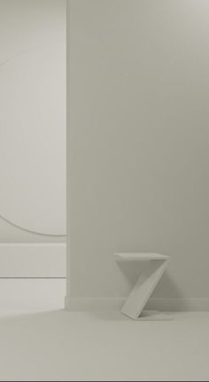 the corner of a room with white walls and floor