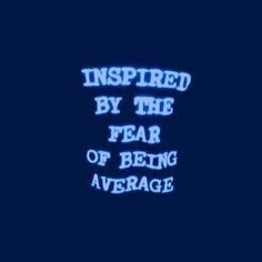 the words inspired by the fear of being average are lit up in blue on a dark background