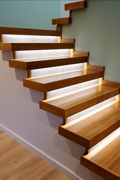 a set of wooden stairs with lights on them