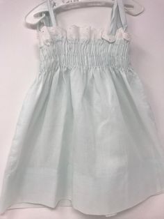 "Vintage pillowcase style dress/shoulder strings 13\" in length /dress length-top to bottom 13 1/2\" including eyelet trim with a 3\" hem available /Pitt to pit 8 1/2\" to 9\"/no issues very little stretches available through chest/smoke free environment/no issues other than age(137)" Cute Sundress With Smocked Back For Garden Party, Cute Daywear Dresses With Smocked Back, Cute Summer Sundress With Smocked Bodice, Beach Dresses With Smocked Ruffled Straps, Summer Smocked Dress For Playtime, Summer Playtime Dresses With Smocked Back, Lined Summer Dress For Baptism, Cute Smocked Summer Dress, White Smocked Sundress With Ruffled Straps