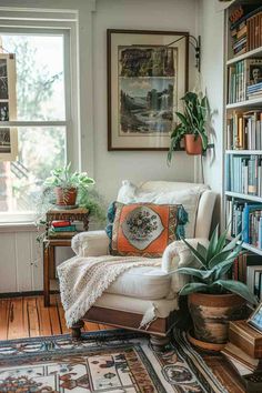 a living room filled with lots of books and furniture