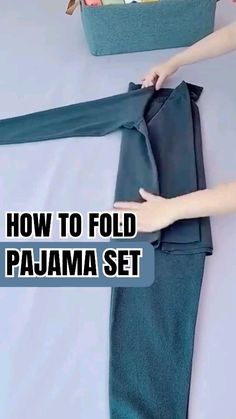 a person is holding onto a piece of cloth with the words how to fold a pajama set