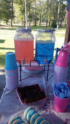 a table topped with lots of desserts and drinks