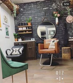 a chair and mirror in a room with brick walls