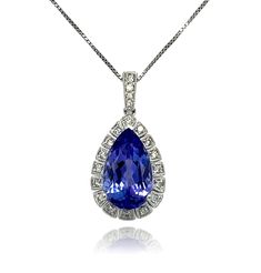 This stunning solitaire tear drop AAA quality Tanzanite pendant is surrounded by top quality shimmering brilliant cut diamonds. Comes with a gold chain. Pendant is brand new with tags attached. It comes in a beautiful box ready for the perfect gift! 18KW:          2.10 gms Tanz wt:      3.81 cts Tanz stones:  1 pear shape, 14x8 mm Diam wt:       0.16 cts Diam stones: 20 round brilliant cut diamonds, Color: H, Clarity: SI Free shipping within the US! Usually ships within 1-2 business days Retail value: $5975 Gold Chain Pendant, Tanzanite Pendant, Halo Earrings Studs, Halo Pendant, Chain Pendant, Diamond Halo, Tear Drop, Round Brilliant Cut Diamond, Pear Shape