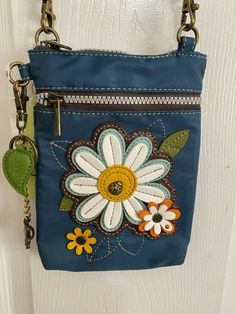 CHALA "VENTURE" RFID PROTECTED DAISY CELL PHONE CROSSBODY BAG - TEAL Adorable & Charming!!  Top Zipper Closure  6.25" x 1.25" x 8"   Detachable, Adjustable Strap (15" - 30") Nylon - Entire Bag is RFID Protected 3 interior credit cards slots - top zipper closure - front zipper pocket - back pocket    HOLDS A LARGE CELL PHONE IN A PROTECTIVE CASE - USE EITHER FRONT OR BACK POCKET GREAT PRICE AT ONLY $43.00 + FREE GROUND ADVANTAGE SHIPPING (replaced First Class). Will be mailed in an eBay padded envelope. Thank you for viewing. Please visit my store - Holly Noel Sales - for other great items. USA SELLER Upcycle Jeans Bag, Jeans Bags Ideas, Sew Gifts, Diy Jeans Crafts, Artisanats Denim, Blue Jean Purses, Foster Kids, Trendy Sewing Projects