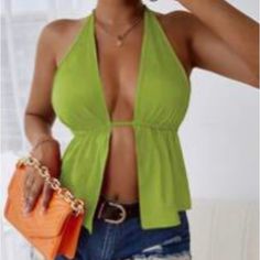 Green Sexy Plain Halter. Halter Backless, Knot, Split Flared Regular. Regular Fit Medium Stretch Fabric 90% Polyester, 10% Elastane. True To Size Spring Club Halter Top With Built-in Bra, Spring Party Low-cut Tank Top, Green Halter Neck Tank Top For Night Out, Chic Low-cut Halter Top For Summer, Green Backless Tank Top For Party, Solid Summer Halter Top For Party, Solid Color Summer Halter Top For Party, Summer Solid Color Halter Top For Party, Chic Low-cut Halter Top For Spring