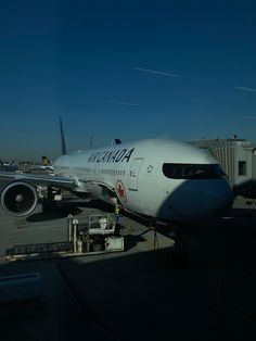 an airplane parked on the tarmac at an airport