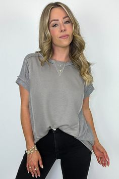 Details: Be ready for any occasion with our High Low Short Sleeve Top! Made with a soft and textured terry fabric, this top features a relaxed fit, round neck, and exposed stitching. The unique hi-low detail on the hem adds a playful touch to this versatile piece. Perfect for dressing up or down! - Short sleeves- Flowy fit Content: 42% POLYESTER 40% COTTON 18% RAYON Size + Fit: Model is 5'4" - wearing a Small - Measurements from a size Small are approx - Full length: 27.5" - Chest: 48" - Waist: Chic Relaxed Fit Top With Frayed Hem, Chic Tops With Frayed Hem And Relaxed Fit, Soft-washed Relaxed Tops For Casual Wear, Solid Color Relaxed Fit Top With Soft Texture, Relaxed Soft-washed Tops For Casual Gatherings, Solid Color Top With Relaxed Fit And Soft Texture, Solid Color Top With Soft Texture And Relaxed Fit, Everyday Crew Neck Top With Soft Texture, Soft Texture Crew Neck Top For Everyday