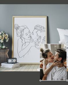 a couple kissing each other in front of some pictures