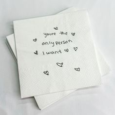 two napkins that have writing on them