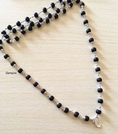 "Sterling Silver Tulsi Mala Necklace made using Sacred Tulsi Wood Beads (Colored Black). This beaded necklace can be worn by men as well as women. This Mala can be worn in multiple ways, it can be worn as it is, or you can attach a pendant/tassel in the lock of this Mala to wear it as a pendant necklace. Tulsi beads are made from Tulsi (Holy Basil) plant wood, considered as most sacred in India. Tulsi plant is worshipped in India and the food offered to Indian Gods is incomplete without the offe Black Polished Beads Necklace For Meditation, Traditional Black Necklace With 8mm Beads, Spiritual Black Beads For Jewelry Making, Black Spiritual Beaded Necklaces With Polished Beads, Spiritual Black Beaded Necklace With Gemstones, Black Spiritual Beaded Necklace With Round Beads, Spiritual Black Beaded Necklaces With Round Beads, Black Beaded Chain Beads As Gift, Black Beaded Chain For Gift