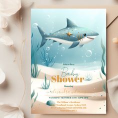 a baby shower card with a shark and starfish on the bottom, under water