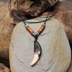 Large Rustic Wolf Tooth Necklace Wolf Teeth Necklace Wolf Necklace Wolf Tooth Necklace Adjustable African Native American Large Wolf Tooth Necklace Simple rustic large wolf tooth necklace made by DiAnna with wood & beads on a adjustable leather cord I purchase these teeth through a trader that goes around buying them and other things from Tibetan farmers that protect their livestock from the wolves Very nice and simple handmade wolf tooth adjustable necklace on a leather cord. Please view all ph Teeth Necklace, Large Wolf, Wolf Tooth Necklace, Largest Wolf, Wolf Tooth, Wolf Teeth, Wolf Necklace, Tooth Necklace, Necklace Simple