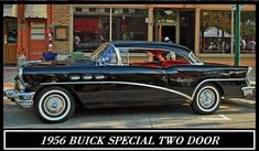 an old black car parked in front of a building with the words, 1956 buick special two door