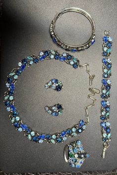 Rare to find this collection complete. Presented is a Lisner MCM Shades of Blue complete jewelry set. Necklace, ear clips, two bracelet choices and a brooch. Each preserved and appear as new. All stones secured and accounted. This vintage set is for that fashion minded woman who loves to make a statement with or without jewelry. This set took months to track down and acquire. Don't let her Majesty's collection go unnoticed. Ear Clips, Crystal Necklaces, Set Necklace, Fort Lauderdale, Shades Of Blue, Crystal Necklace, Jewelry Set, Jewelry Necklaces, Track