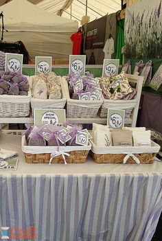 baskets filled with purple and white items sitting on top of a table