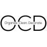 an image of the logo for organic kitchen and decora, which is located in front of