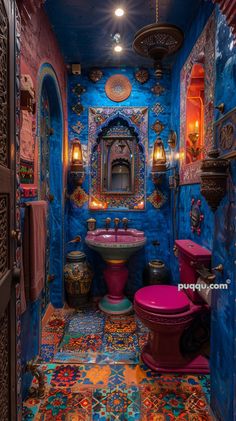 a bathroom with blue walls and colorful decorations on the floor, including a pink toilet and sink