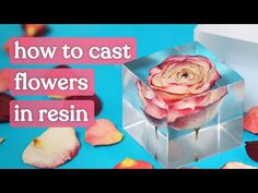 an open box with flowers in it and the words how to cast flowers in resin