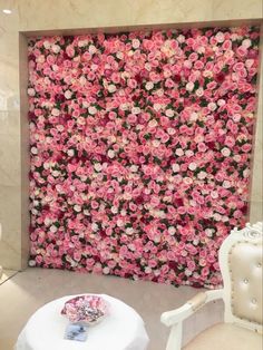 a large pink flowered wall in the corner of a room