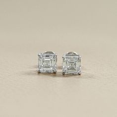 Natural Asscher Diamond Earrings in White Gold/ Radiant, Ethically Sourced Diamond Studs/ Classic Minimalist Design for Luxurious Style. SKU: EDS0100 ✯✯ 𝐃𝐢𝐚𝐦𝐨𝐧𝐝 𝐃𝐞𝐭𝐚𝐢𝐥𝐬 ✯✯ ➺ Shape: Asscher ➺ Color-Clarity: EF-VS/SI, GH-VS/SI ➺ Weight: 0.25 To 1.00 TCW ➺ Diamond Type: Natural Earth-Mined ✯✯ 𝐄𝐚𝐫𝐫𝐢𝐧𝐠𝐬 𝐃𝐞𝐭𝐚𝐢𝐥𝐬 ✯✯ ➺ Setting Type: Prong ➺ Back Type: Screw Back or Push Back ✯✯ 𝐆𝐨𝐥𝐝 / 𝐏𝐥𝐚𝐭𝐢𝐧𝐮𝐦 𝐃𝐞𝐭𝐚𝐢𝐥𝐬 ✯✯ ➺ It can be made in 10K/ 14K/ 18K Solid Gold & 950 Platinum. ➺ Gold metal tones can be made in Yellow, White & Rose. ✯✯ 𝐂𝐞𝐫𝐭𝐢𝐟𝐢𝐜𝐚𝐭𝐢𝐨𝐧𝐬 ✯✯ ➺ We offer IGI/GIA certifications as an optional service for an additional fee. If you would like to include certification with your purchase, please inform us before placing your order. For more deta Earrings White Gold, Asscher Diamond, Jewelry Showcases, Earrings White, Natural Earth, Dream Jewelry, Perfect Gift For Her, Gold Platinum, Diamond Studs