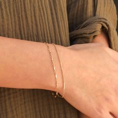 This is a set of layering bracelets inspired by our Shoreline and Shoreline Toggle Necklace. These bracelets look stunning when layered together but also when each bracelet is worn individually or with other bracelets to complete your fabulous look. Made out of high quality gold filled materials and perfect for everyday wear. One set of two chain bracelets: Spring ring clasp (6mm) 14K gold filled chain 1" extender option available Nickel-free Adjustable Chain Bracelets For Layering, Adjustable Stackable Chain Bracelet For Layering, Trendy Adjustable Chain Bracelets For Layering, Adjustable 14k Gold-filled Bracelets For Layering, Adjustable 14k Gold Filled Bracelets For Layering, Chic Everyday Bracelets With Delicate Chain, Trendy Gold Double Chain Bracelet, Chic Adjustable Double Band Bracelet, Trendy Gold Bracelets For Layering