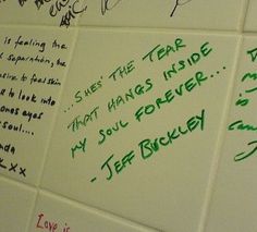 several handwritten notes on the wall of a public restroom