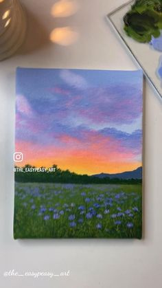 a painting of a sunset over a field with wildflowers