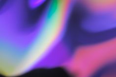 the blurry image is very colorful and shows what appears to be an abstract background