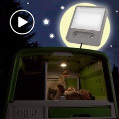 an image of the inside of a truck at night with stars and moon in the sky