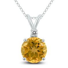 A beautiful 5mm round shaped citrine and diamond pendant necklace set in a 14K white gold basket setting. A single diamond weighs 0.02 carat. The pendant hangs from an 18 inch chain also crafted in 14K white gold. Round Topaz Necklace With Diamond Accents, Round Topaz Necklaces With Diamond Accents, Gold Basket, Diamond Pendants Designs, Basket Setting, Stylish Watches, Diamond Pendant Necklace, Pendant Design, Diamond Pendant