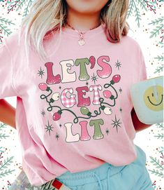 Looking for the perfect christmas gift? Look no further than our pink let's get lit christmas shirt! This festive top is perfect for celebrating the holidays with your loved ones. Not to mention, the festive graphics make it the perfect addition to any christmas outfit. Get yours today! * Q U I C K * F A C T S * ✺ 100% ring-spun cotton ✺  Medium fabric (6.1 oz/yd² (206.8 g/m ✺ Wash and dry normally (on cool for best results) ✺ Product color may slightly vary due to photographic lighting sources or your monitor settings  * S I Z I N G * ✺ Sizing is unisex so runs like men's. ✺ Most women find their typical size works best, since they are meant to fit a touch loose and go up 1 or 2 sizes if you want the oversized look. ✺ Size guide and fit:  The size chart is listed in photos above.  Please Pink Christmas Shirt, Little Sister Gifts, Lets Get Lit, Womens Christmas, Womens Christmas Shirts, Nurse Christmas, Make Her Smile, Festival Tops, Comfort Colors Shirt