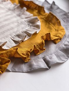 the ruffles on the fabric are yellow and grey