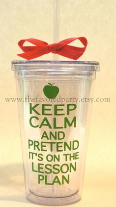 a plastic cup with a red ribbon around it and the words keep calm and pretend it's on the lesson plan