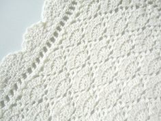 a white crocheted doily on a table