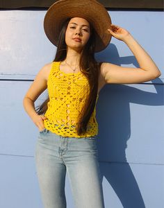 Vintage crochet tank top in yellow. Sleeveless. Scoop neckline. Size S, UK 6-10 / EU 34-38. Measurements- 34"(86cm) bust - 20"(51cm) top length. Material- Wool Condition - Excellent. Care - Handwash Cold Handpicked, repaired and ready to wear. This is an original vintage item, not new and minor signs of wear & age are expected, we will highlight any major flaws.Model is a UK 6/8 and is 5'7" tall Crochet Sleeveless Tank Top For Vacation, Sleeveless Crochet Top For Summer, Yellow Camisole Crop Top For Summer, Casual Crochet Sleeveless Tank Top, Spring Vacation Crochet Tank Top, Sleeveless Stretch Crochet Top For Summer, Stretch Sleeveless Crochet Top For Summer, Summer Crochet Sleeveless Tank Top, Casual Crochet Sleeveless Top