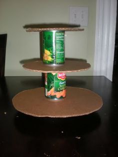 three tiered shelves with canned food on them