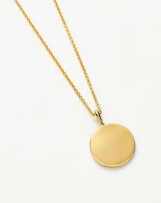 Engravable Round Necklace 18k Gold Vermeil. Make It Personal with a Necklace. Paired with a Delicate Chain, the Smooth Clip-On Pendant Can be Engraved on Both Sides – the Perfect Gift for that Special Someone. Opt for the Engravable Round Disc Pendant. Please Note: Engraving Items May Take 2 Working Days to Process. Metal: 18K Gold Plated Vermeil on Sterling Silver Pendant Dimensions: 15mm Chain Metal: 18K Gold Vermeil on Sterling Silver Short Plain Chain: Total Length 450mm with Extension Links Minimalist Yellow Gold Medallion Pendant Necklace, Elegant Gold Medallion Necklace With Cable Chain, Elegant Gold Medallion Necklace On Cable Chain, Elegant Medallion Necklace With Cable Chain, Classic Tarnish Resistant Medallion Necklace For Gift, Classic Gift Medallion Necklace Tarnish Resistant, Classic Tarnish-resistant Medallion Necklace Gift, Elegant Yellow Gold Medallion Necklace With Cable Chain, Elegant Yellow Gold Round Disc Necklaces